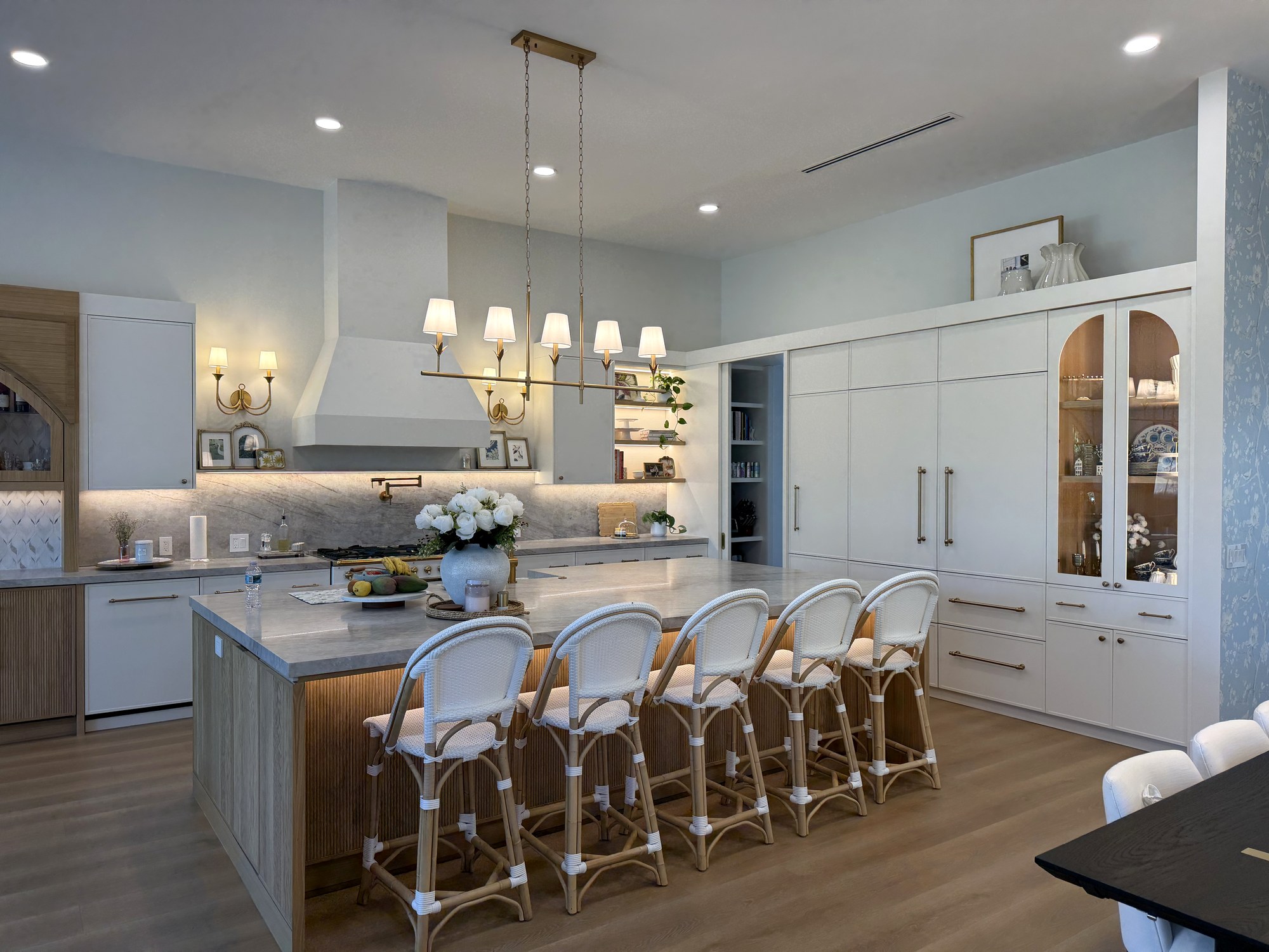 Open concept kitchen with custom island and integrated appliances